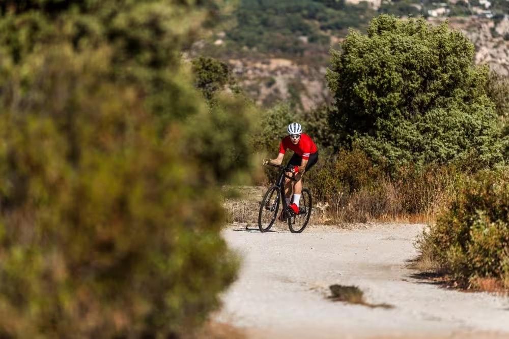 gravel cyclist through countryside.jpeg