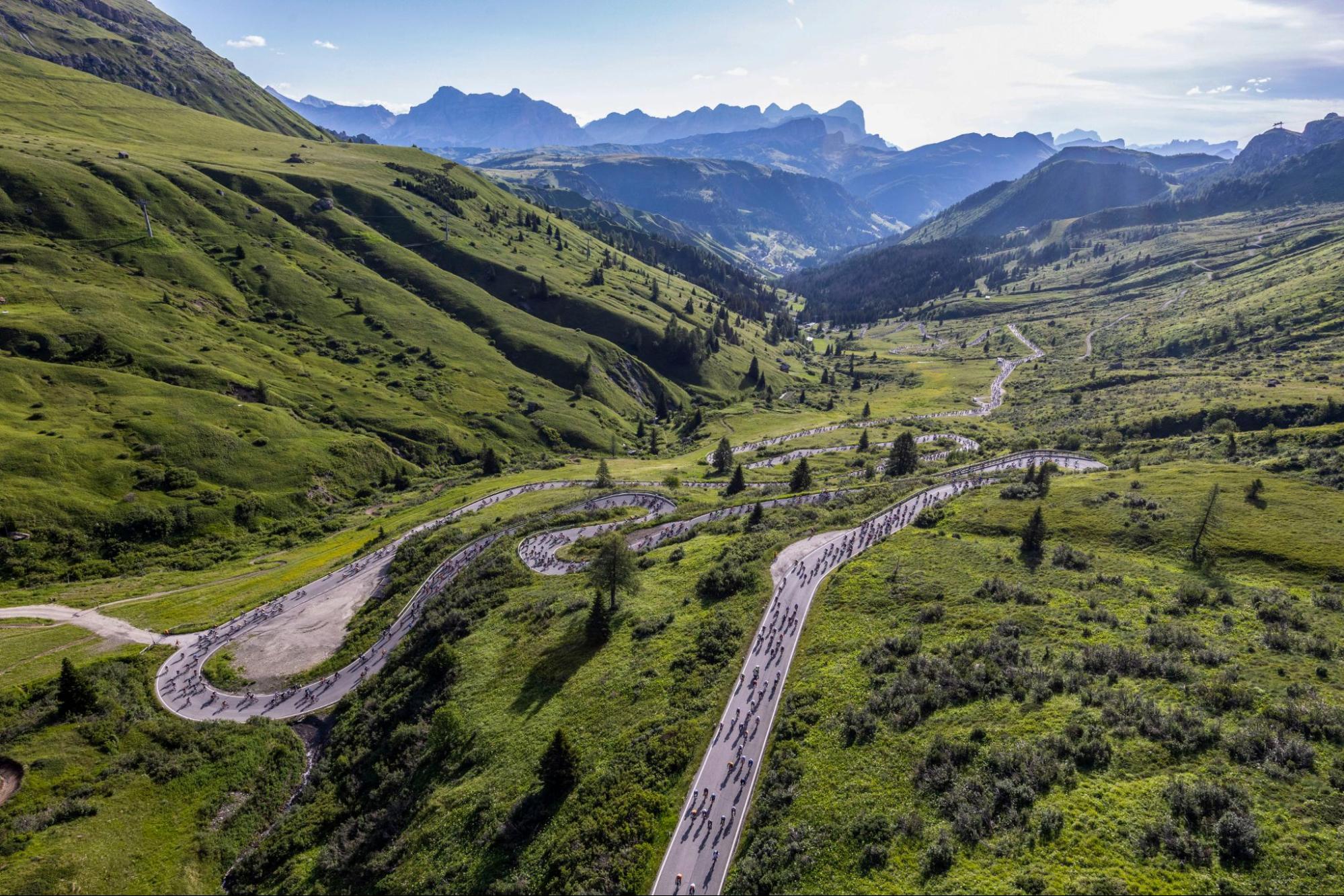 Winding road climbing a Dolomites pass on the Maratona dles Dolomites route