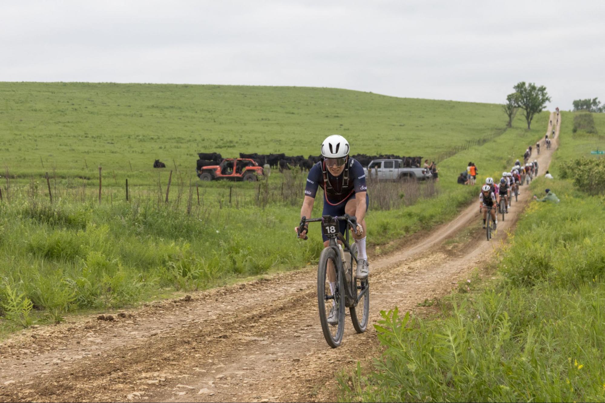 Cyclist riding outdoors to practise handling and kit before a gravel cycling event