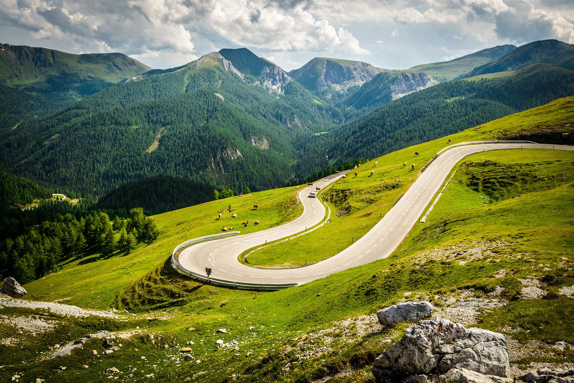 Austria’s alpine roads combine long climbs with quieter valley riding and less traffic than many larger Alpine regions.