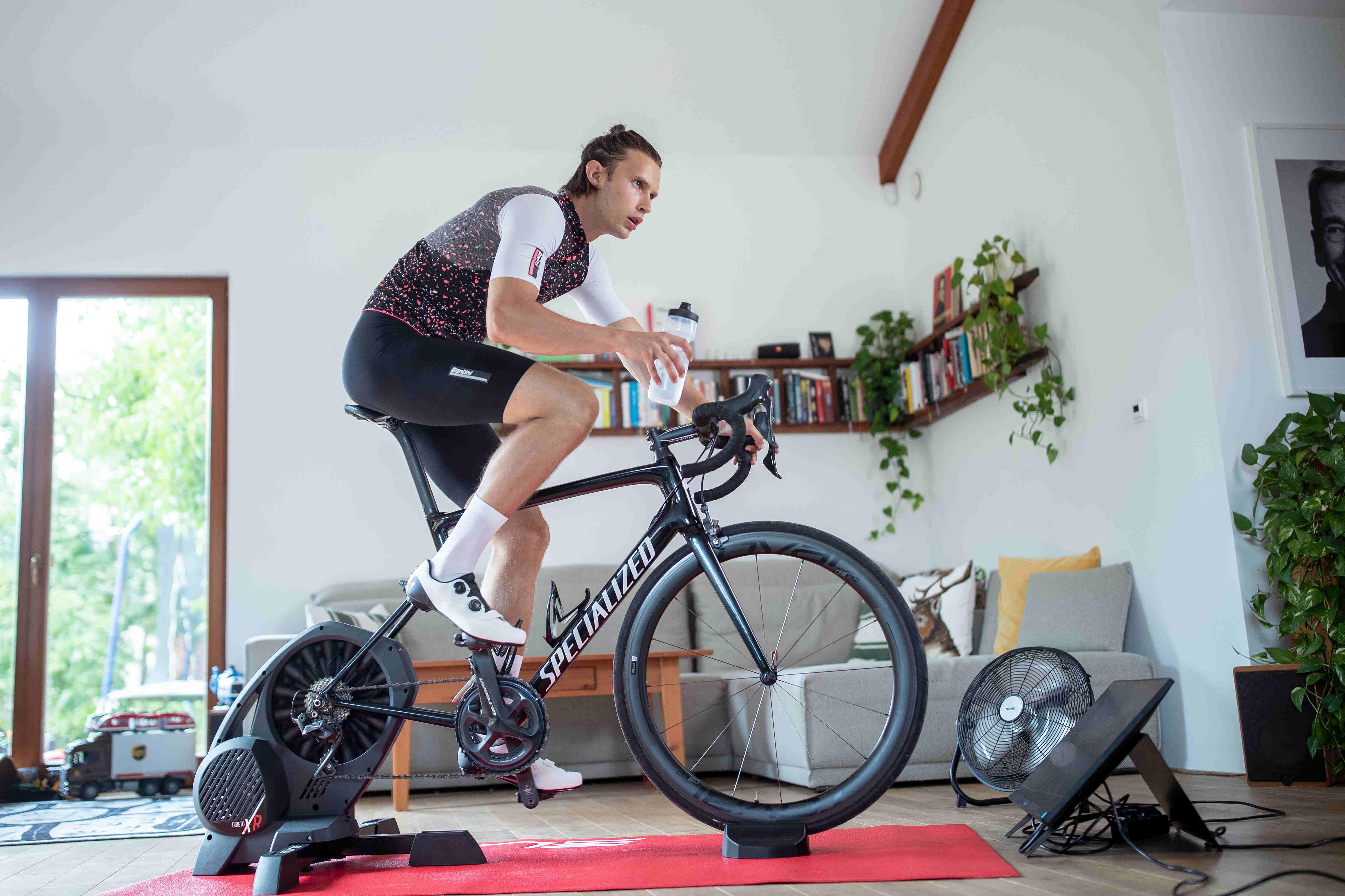 Indoor cyclist taking on fluids