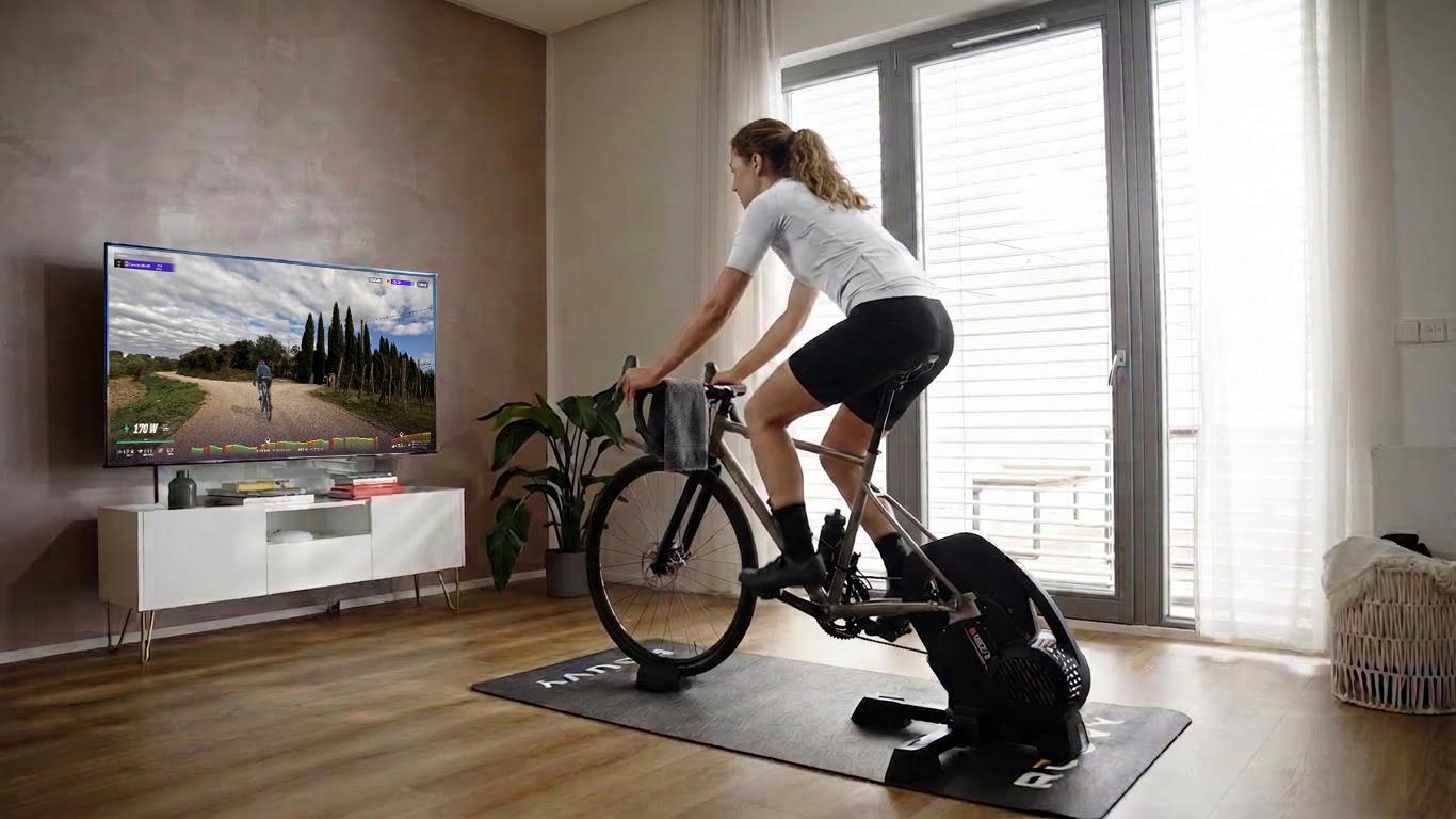 Cyclist on an indoor trainer doing a short taper week session to keep some intensity in the legs