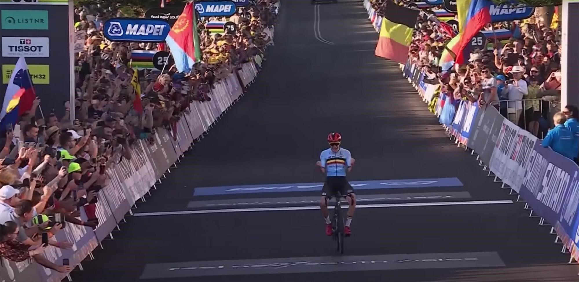 Remco Evenapoel reaching the finish line and winning World Road Champs in 2022